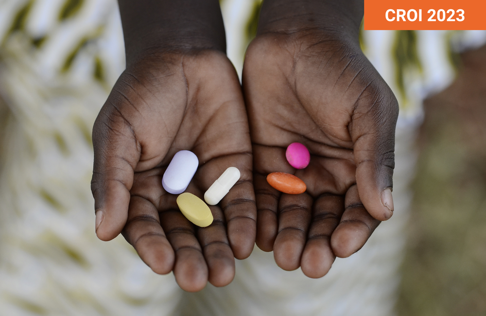 Person holding pills in their hands.