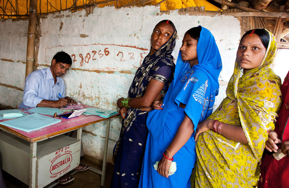 Pregnant woman is wearing blue sari, Stock image