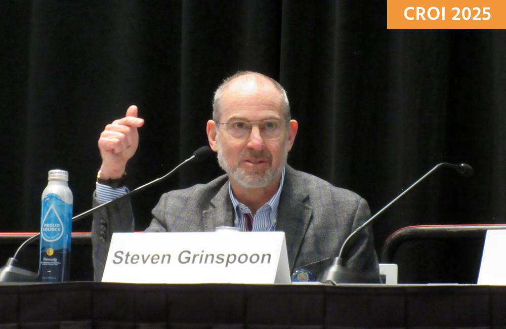 Professor Steven Grinspoon at a media briefing at CROI 2025, talking into a microphone.